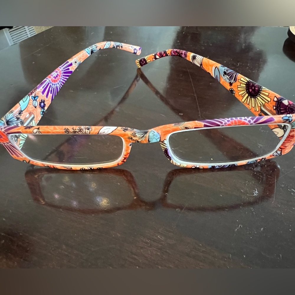 Orange flower print readers. 1.25